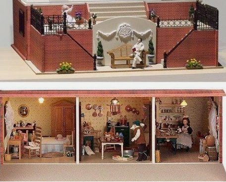 A miniature dollhouse-basement, with a brick exterior, stairs, balcony, and three interior rooms filled with tiny furniture and figurines.