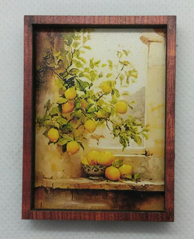 A framed still life painting depicting a lemon tree with yellow lemons and green leaves, set in a rustic interior with a window, enclosed in a dark brown wooden frame and mounted on a textured light gray wall.