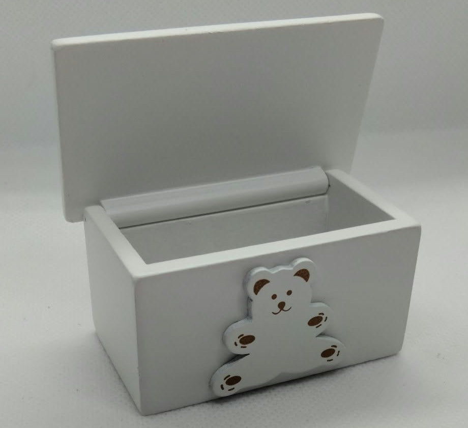 A small white wooden miniature toy box with its lid propped open, featuring a decorative bear-shaped ornament on the front.