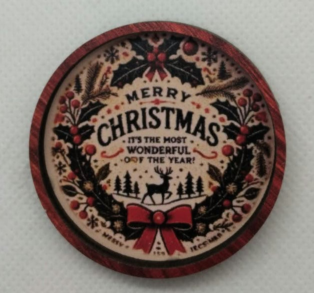 a dolls house miniature christmas round  decoration on a white background